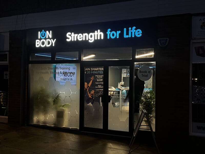 An image of the lit-up channel letters for ION Body Strength for Life.